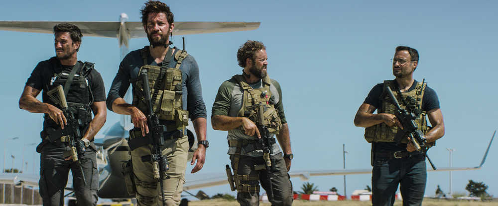 In this photo provided by Paramount Pictures shows Pablo Schreiber, from left, as Kris "Tanto" Paronto, John Krasinski as Jack Silva, David Denman as Dave "Boon" Benton and Dominic Fumusa as John "Tig" Tiegen, in the film, "13 Hours: The Secret Soldiers of Benghazi" from Paramount Pictures and 3 Arts Entertainment/Bay Films. The movie releases in U.S. theaters Jan. 15, 2016. (Christian Black/Paramount Pictures via AP)