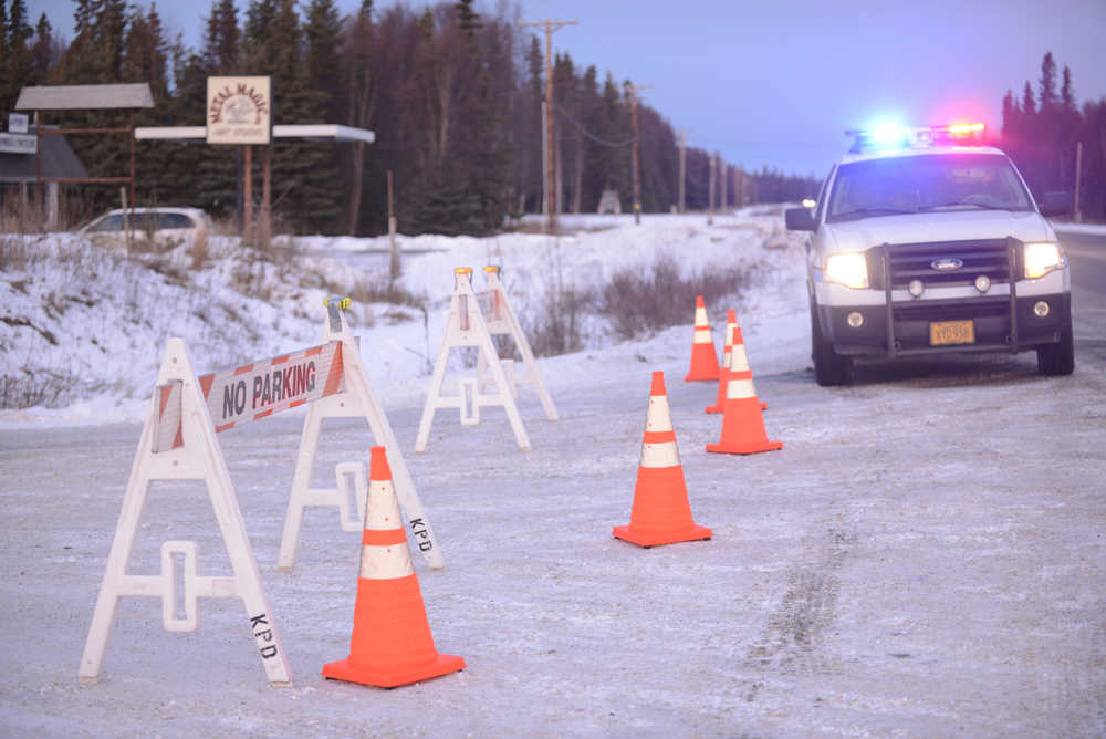 Photo by Megan Pacer/Peninsula Clarion Enstar Natural Gas personnel work at the intersection of Lilac Lane and the Kenai Spur Highway after shutting off the area's gas supply on Sunday, Jan. 24, 2016 in Kenai, Alaska. A 7.1 magnitude earthquake caused gas explosions in four houses along Lilac Lane.