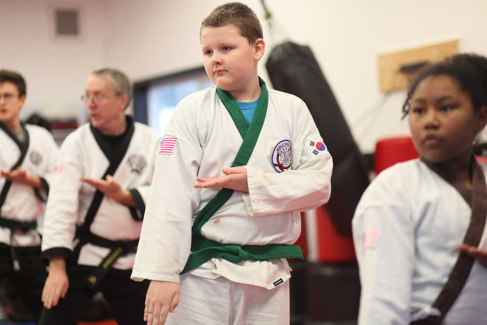 Photo by Kelly Sullivan/ Peninsula Clarion Sam Festervand concentrates during practice Thursday at Soldotna Martial Arts in Soldotna, Alaska. He attends class at the studio three days each week, which, he said, has helped him develop more confidence.