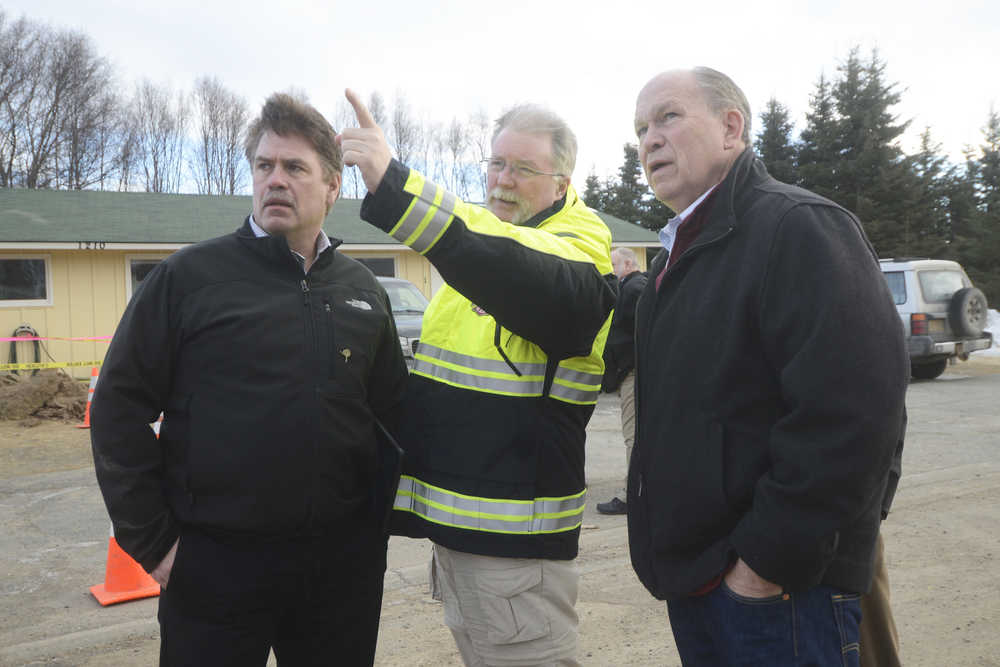 Photo by Megan Pacer/Peninsula Clarion Kenai City Council member and Vice Mayor Brian Gabriel, Kenai Fire Chief Jeff Tucker and Gov. Bill Walker survey the damage the Jan. 24 magnitude 7.1 earthquake did to four homes during Walker's visit on Sunday, Jan. 31, 2016 on Lilac Lane in Kenai, Alaska. Walker heard from city and borough officials and from utility companies about how the quake was handled during Sunday's briefing at the Kenai Chamber of Commerce and Visitor Center.
