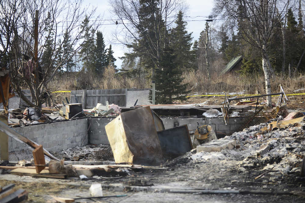 Photo by Megan Pacer/Peninsula Clarion Debris covers the ground where a house once stood on Sunday, Jan. 31, 2016 on Lilac Lane in Kenai, Alaska. Two homes exploded and another two caught on fire after a 7.1 magnitude earthquake rocked the Kenai Peninsula on Jan. 24.