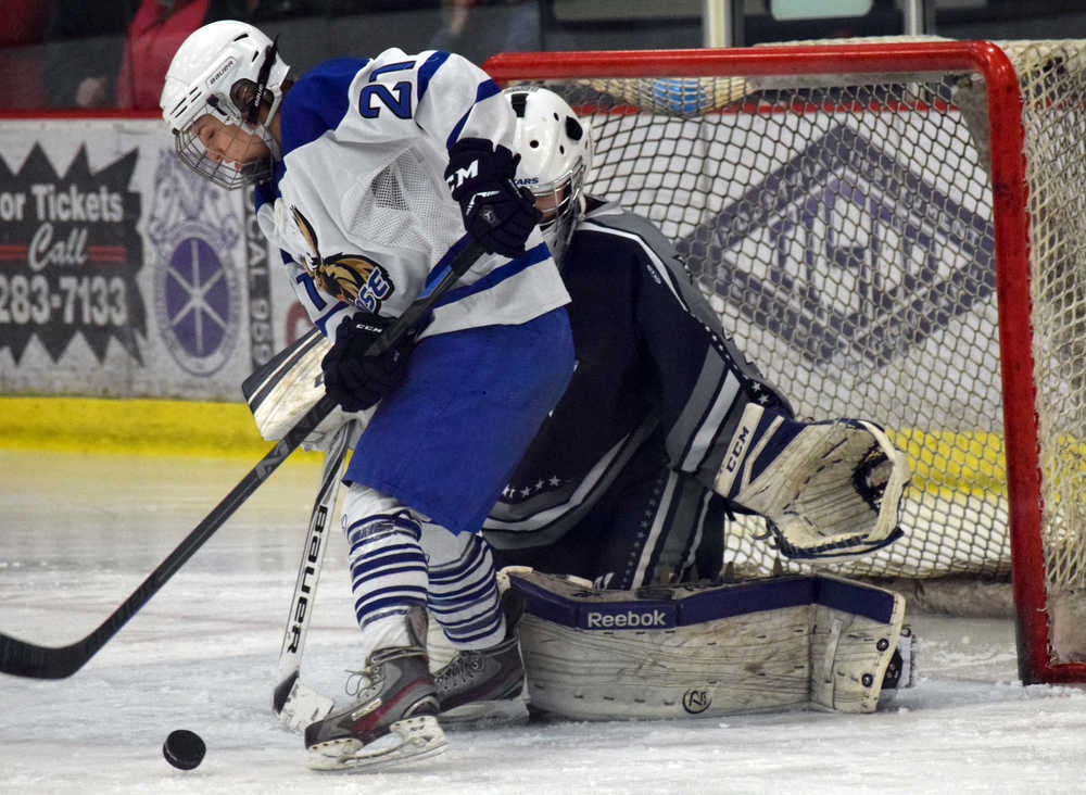 Photo by Jeff Helminiak/Peninsula Clarion Palmer's Haley Hanson can't stuff a goal by Soldotna goalie Billy Yoder in the Friday semifinals of the North Star Conference tournament at the Soldotna Regional Sports Complex.