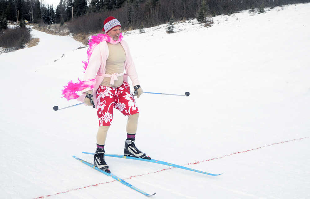 Photo by Megan Pacer/Peninsula Clarion Kenai resident Mike Bergholtz crosses the finish line of the "drag race" that followed the Women's Stud Run on Sunday, Feb. 7, 2016 at the Tsalteshi Trails in Soldotna, Alaska.