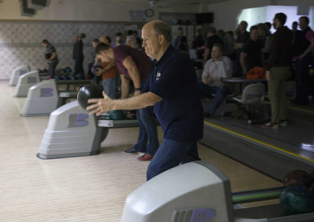 In this Feb. 4, 2016, photo, Alaska Gov. Bill Walker bowls with fellow legislators and staff in Juneau, Alaska. It was his first night of bowling with the legislative bowling leagues. Bipartisan, bicameral bowling has been a staple of Alaska's legislative session for nearly 30 years. (AP Photo/Rashah McChesney)