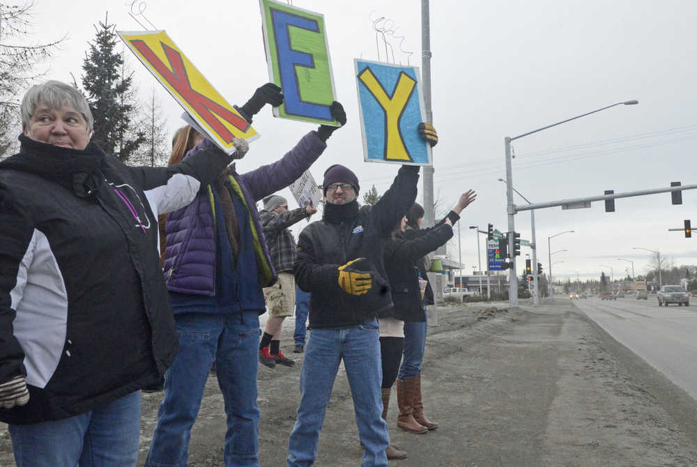 Members of the Key Coalition, an advocacy group for state healthcare waiver applicants, hold their annual rally beside the Sterling Highway on Friday, Feb. 19 near Soldotna Creek Park. The group has rallied yearly since 1988 to draw attention to those waiting for state waivers that would give them Medicaid-funded care outside of an institution, allowing the severely disabled to remain in their homes and communities.