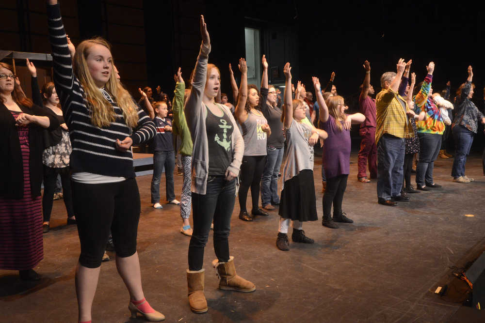 Members of the Kenai Performers run through one of the first numbers in "The Music Man" during a rehearsal on Tuesday, Feb. 16 2015 at Kenai Central High School in Kenai, Alaska.