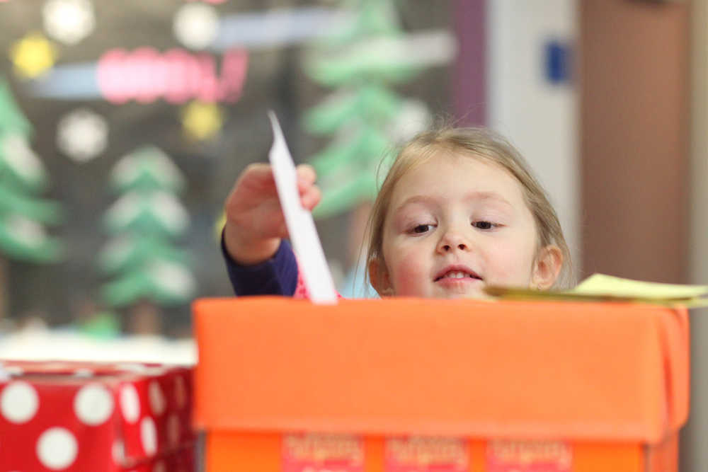 Photo by Kelly Sullivan/ Peninsula Clarion XXX takes her turn to drop an answer to the XXX in the XXX box Wednesday, Feb. 24, 2016, at Nikiski North Start Elementary in Nikiski, Alaska. XXX