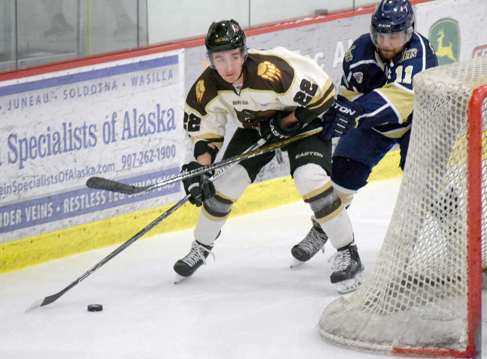 Photo by Jeff Helminiak/Peninsula Clarion Kenai River Brown Bears forward Joey Sardina attacks behind the janesville (Wisconsin) Jets' net against defenseman Pat Gazzillo on Friday at the Soldotna Regional Sports Complex.