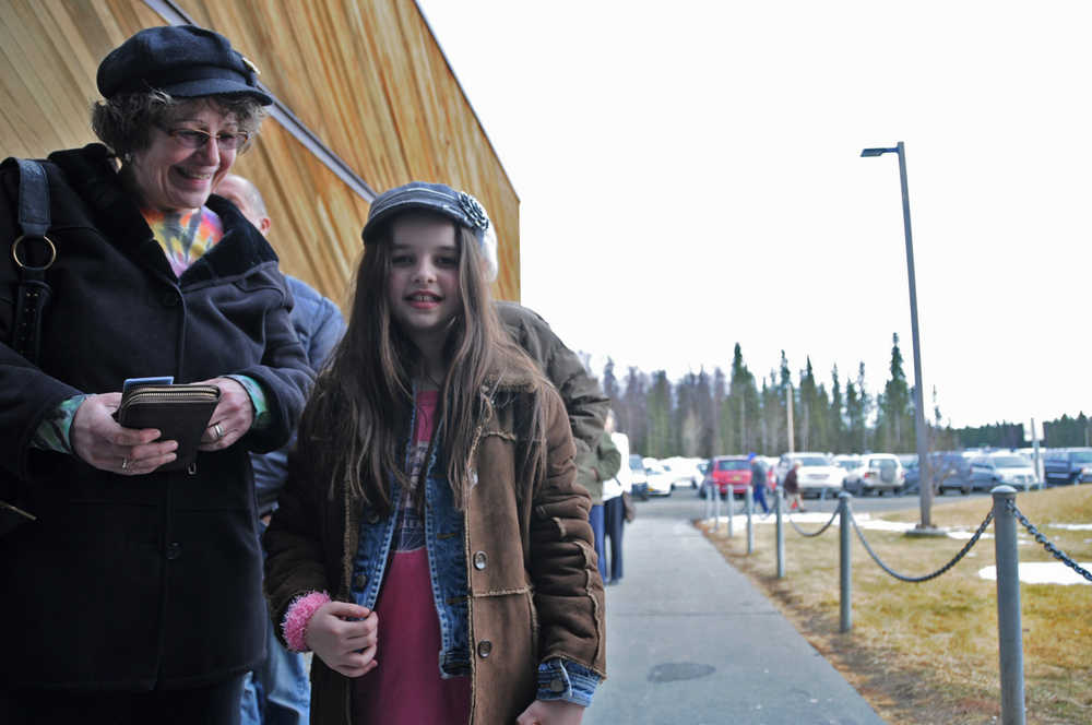 Photo by Elizabeth Earl/Peninsula Clarion Greenley Viefeld, 10, of Clam Gulch, waits in the long line outside the Soldotna Sports Complex with her grandmother, Dana York. Viefeld accompanied York while she voted in the Republican Presidential Preference Poll in Soldotna on Tuesday, March 1, 2016.