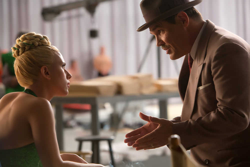 In this image released by Universal Pictures, Scarlett Johansson, left, and Josh Brolin appear in a scene from "Hail, Caesar!." (Alison Rosa/Universal Pictures via AP)