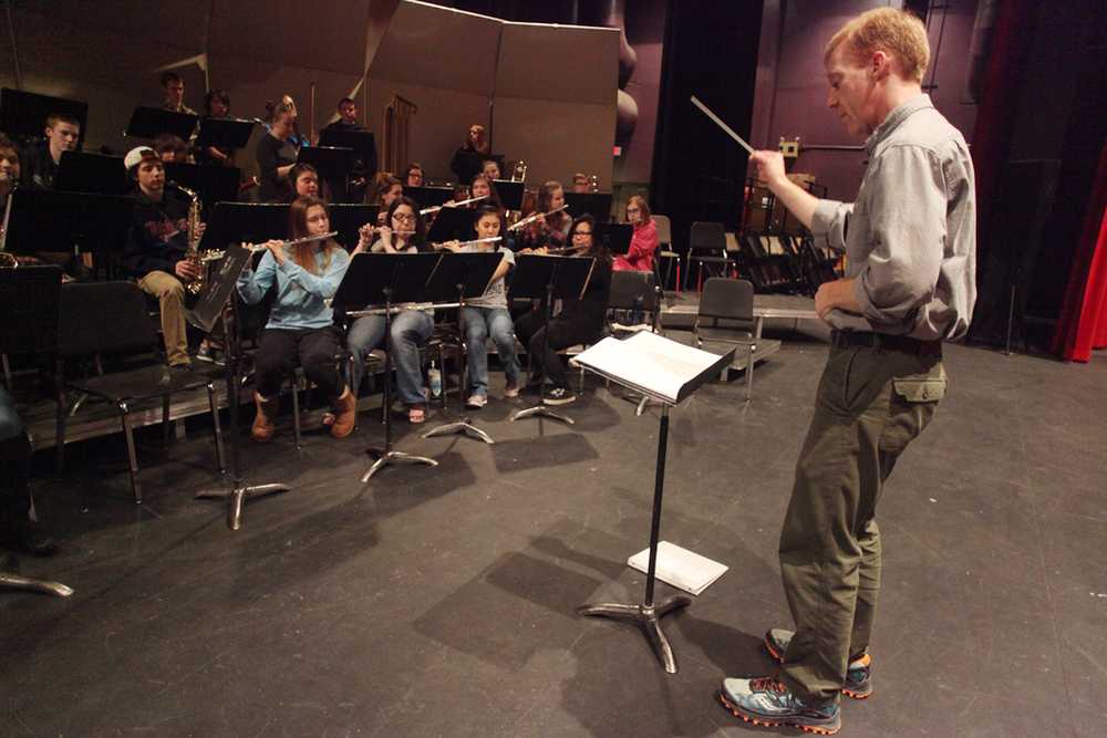 Photo by Kelly Sullivan/ Peninsula Clarion Soldotna High School teacher Kent Peterson leads his band students in a rehearsal before their concert for Music in Our Schools Month Wednesday, March 2, 2016, at Soldotna High School in Soldotna, Alaska.