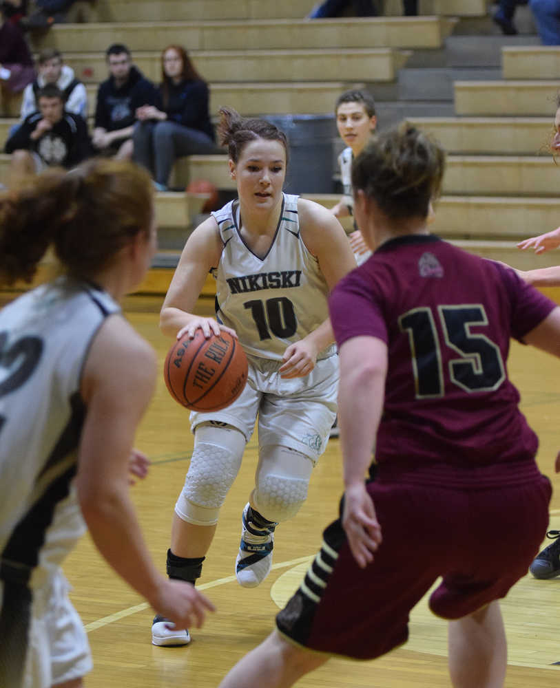 Photo by Joey Klecka/Peninsula Clarion Nikiski forward Hallie Riddall looks for an opening against Grace Christian in a Southcentral Conference game Feb. 18 at Nikiski High School.