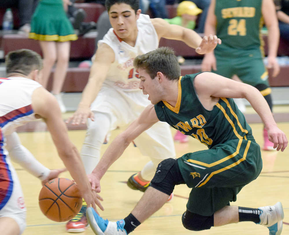 Photo by Joey Klecka/Peninsula Clarion Seward guard Thomas Zweifel loses the ball on a drive to the basket in Friday's semifinal game against ACS at the Southcentral Conference tournament at Grace Christian High.