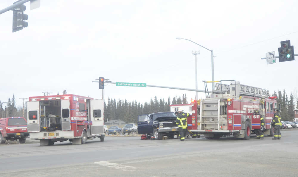 Members of Central Emergency Services attend to the scene of a two-vehicle accident blocking traffic on Tuesday, March 15, 2016 at the intersection of Kalifornsky Beach Road and Poppy Lane in Soldotna, Alaska.