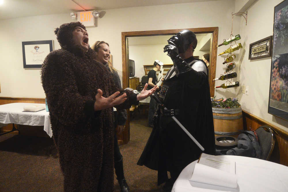 Photo by Megan Pacer/Peninsula Clarion Chris Peppers, left, Delana Green (Duncan) and Rob Ernst joke with each other before a rehearsal for the Triumvirate Theatre's upcoming dinner theatre and auction on Tuesday, March 22, 2016 at Mykel's Restaurant in Soldotna, Alaska.