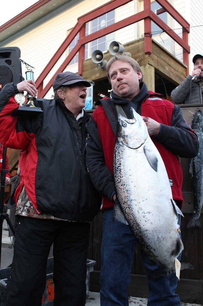 Winter King Salmon Tournament Champion Eric Holland and his wife celebrate when his fish is announced as first place. Holland was awarded $31,668 for the 26.45 pound king, scoring more money than last year's first place winner. Holland, as well as all the other anglers who placed in the top four, is a Homer resident. (Photo by Anna Frost, Homer News)