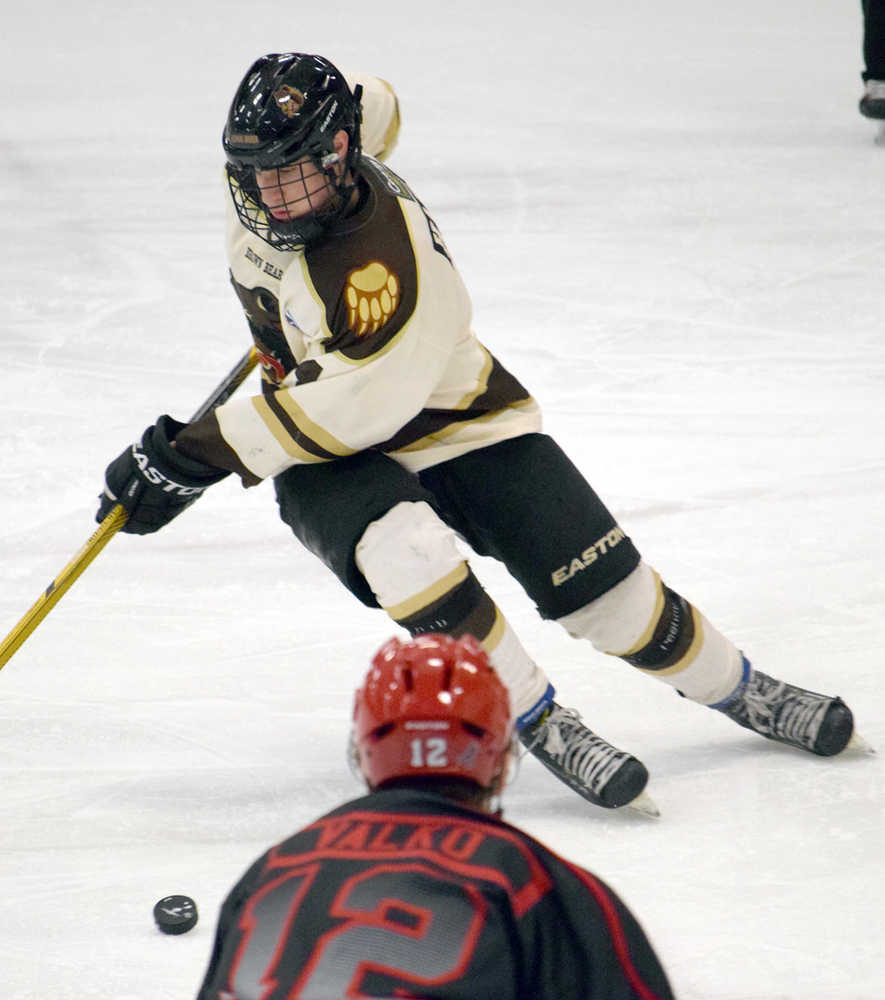 Photo by Jeff Helminiak/Peninsula Clarion Kenai River Brown Bears defenseman Jake Hartje controls the puck March 18 against the New Jersey Titans at the Soldotna Regional Sports Complex.