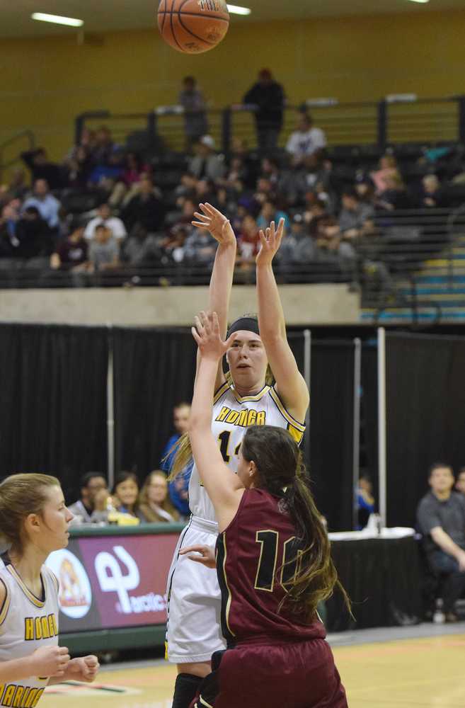 Photo by Joey Klecka/Peninsula Clarion Homer senior Madison Akers shoots a 3-pointer over Grace Christian defender Hayley Hagen (10) in Thursday's Class 3A girls state tournament quarterfinal round at the Alaska Airlines Center in Anchorage.