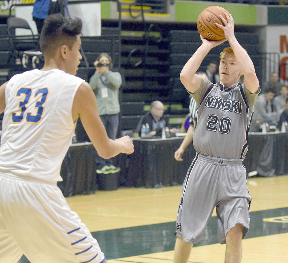 Photo by Joey Klecka/Peninsula Clarion Nikiski guard Jace Kornstad puts up a 3-point shot against Barrow in Thursday's Class 3A boys state quarterfinal at the Alaska Airlines Center in Anchorage.