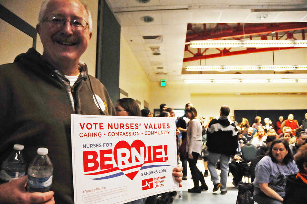 Photo by Elizabeth Earl/Peninsula Clarion Randall Knowles turned out to the Democratic caucus at Kenai's Challenger Learning Center Saturday morning to support Bernie Sanders.