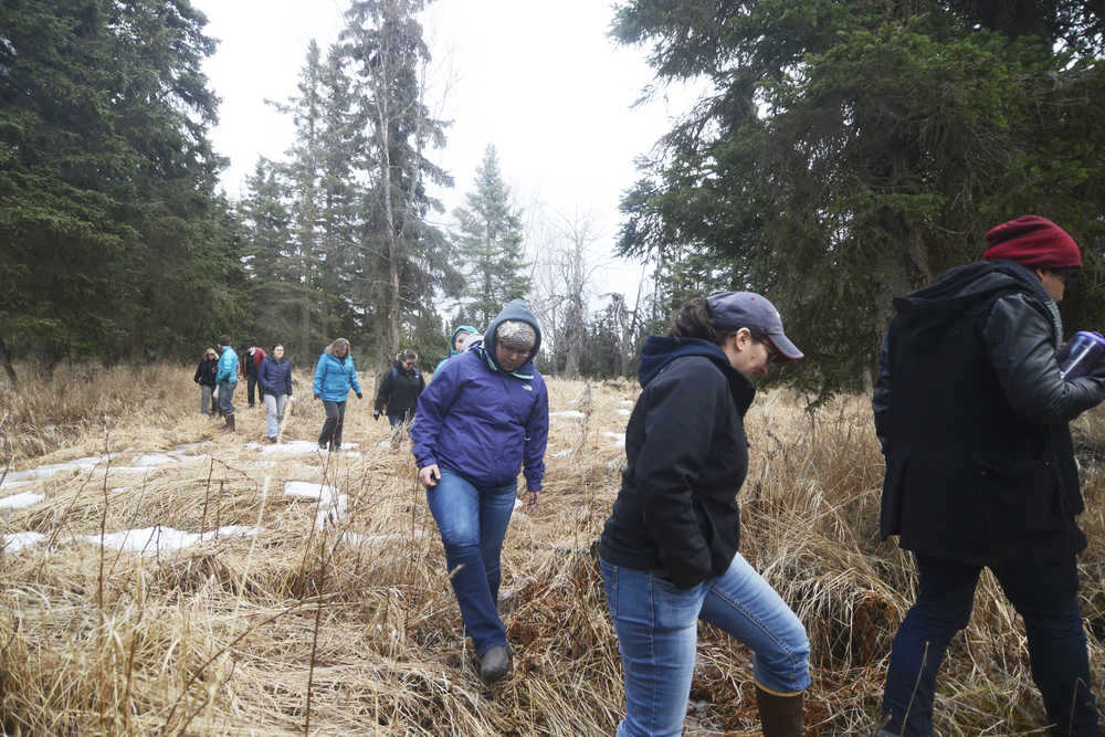 Photo by Megan Pacer/Peninsula Clarion Kenaitze Indian Tribe members, students and Kenai Peninsula College faculty get ready for an opening prayer led by Dena'ina Elder Max Chickalusion Jr. on Thursday, March 24, 2016 at Kalifornsky Village off of Kalifornsky Beach Road in Alaska.