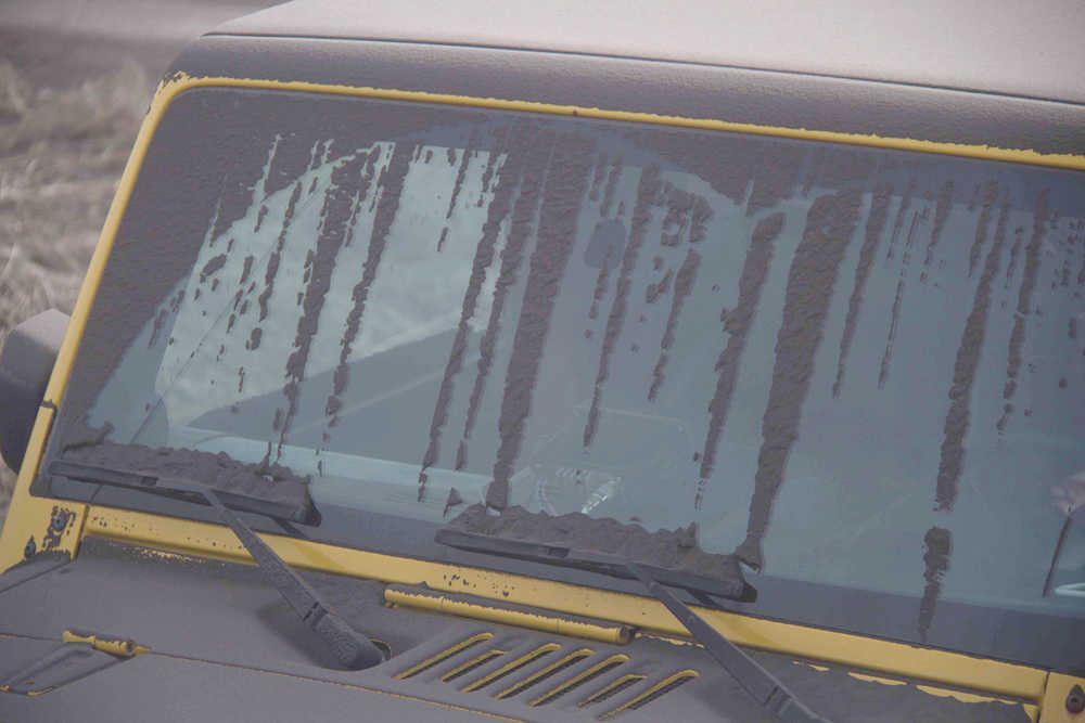 This Monday, March 28, 2016, photo provided by LJ Taylor shows volcanic ash on a vehicle at Nelson Lagoon, Alaska. The Alaska Volcano Observatory says minor amounts of volcanic ash from Pavlof Volcano are being reported on the ground by several Alaska communities. Geologist Kristi Wallace of the U.S. Geological Survey says the most significant fallout was in Nelson Lagoon. (LJ Taylor via AP) MANDATORY CREDIT