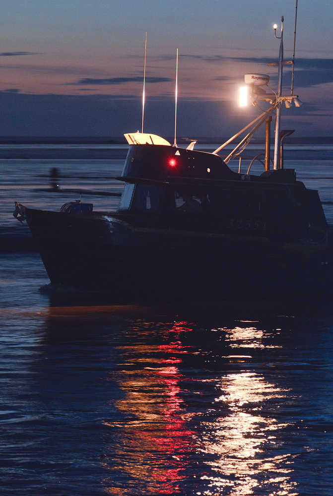 Photo by Rashah McChesney/Peninsula Clarion A commercial drift gillnetting boat leaves the mouth of the Kasilof River at about 1 a.m. Thursday morning July 17, 2014 during an overnight fishing period in Kasilof, Alaska.