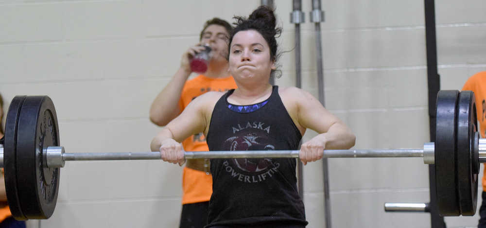 Photo by Jeff Helminiak/Peninsula Clarion Kenai Central senior Cipriana Castellano competes in the clean at the Speed and Strength Training competition Wednesday at Nikiski High School.