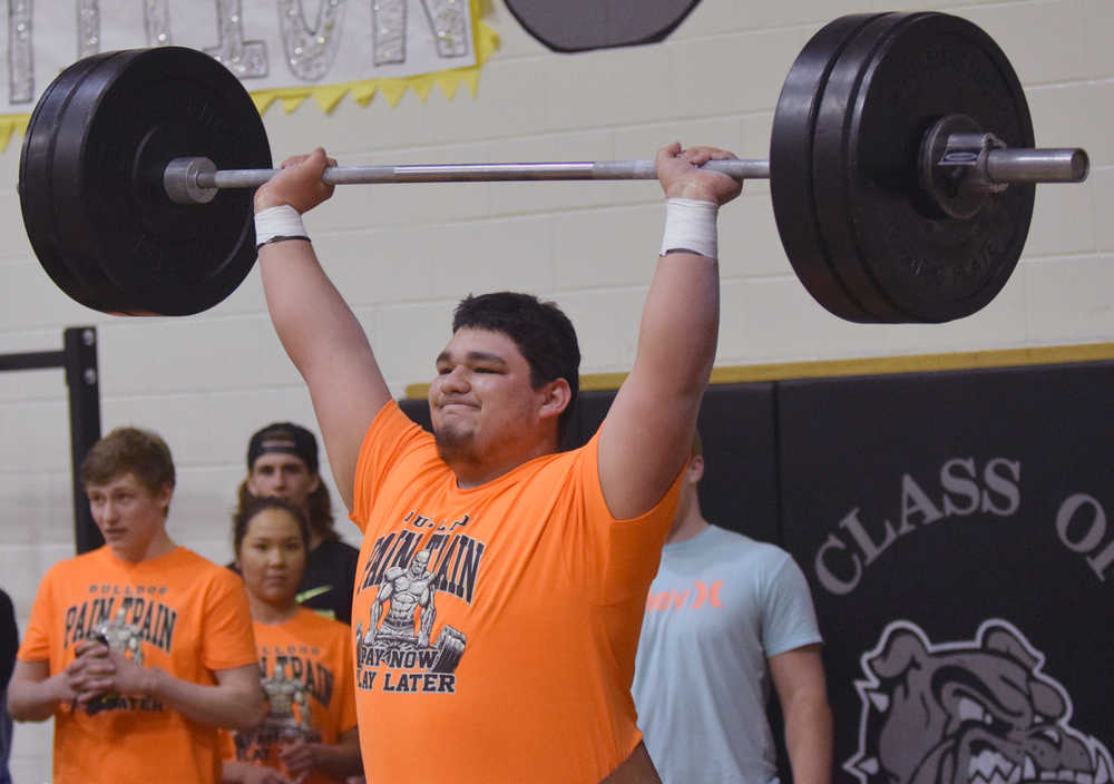 Photo by Jeff Helminiak/Peninsula Clarion Nikiski senior Ruben Sepeda competes in the snatch at the Speed and Strength Training competition Wednesday at Nikiski High School.