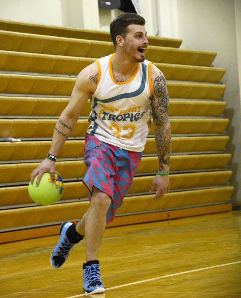 Calvin Williams of the Swamp Donkey dodgeball team comes from the back of the court during a final round against Magnum Motors at the Kenai Chamber of Commerce Young Professionals dodgeball tournament on Saturday, March 26 at the Kenai Central High School gym.