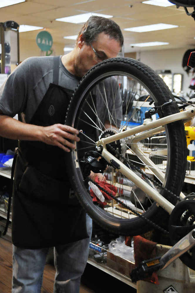 Photo by Elizabeth Earl/Peninsula Clarion Untrue wheels can be another consequence of winter riding, courtesy of ruts and normal wear and tear. Bike mechanics at Beemun's Bike and Ski Loft can true a fairly damaged wheel but will let the owner know if a wheel is beyond saving, said Brad Carver, a mechanic.