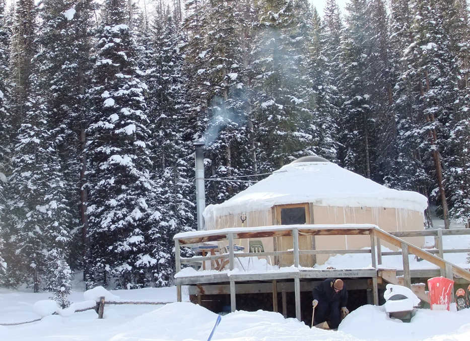 Dan Saxton chopping firewood at a yurt in Colorado prior to joining the cabin program at Kenai National Wildlife Refuge. (Photo courtesy Dan Saxton)