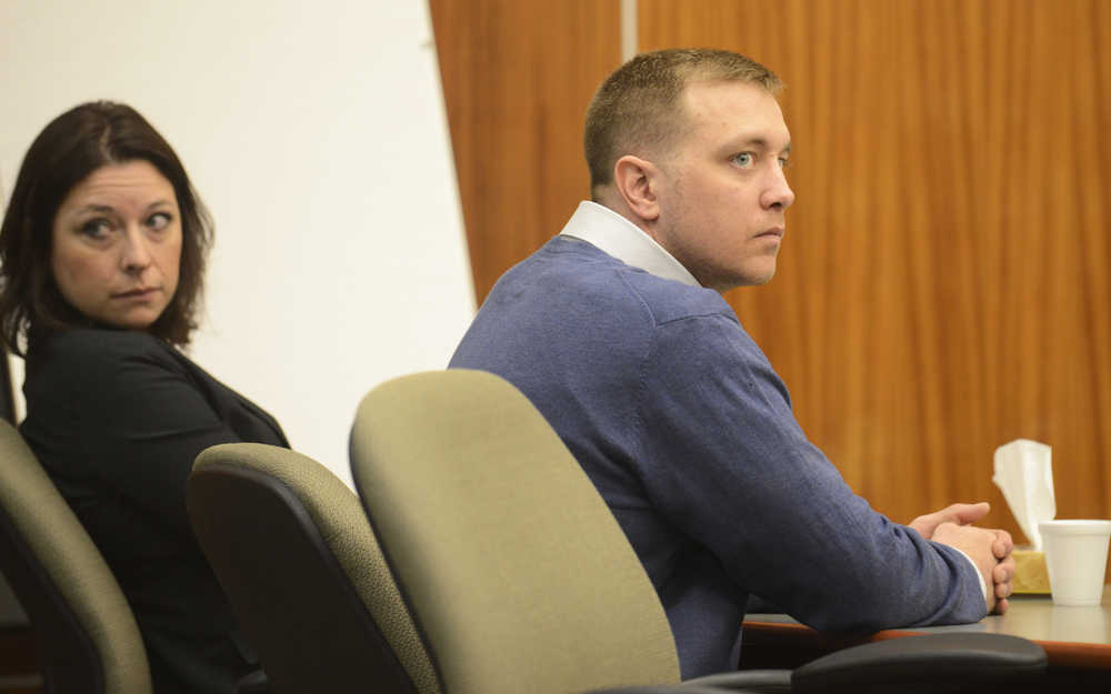 Photo by Megan Pacer/Peninsula Clarion Paul Vermillion, 32, and a member of his defense team listen to his defense attorney, Andrew Lambert, moments before being led out of the courtroom during a remand hearing on Thursday, April 7, 2016 at the Kenai Courthouse in Kenai, Alaska. Vermillion pleaded guilty to one count of manslaughter on Monday, April 4, for the 2013 death of Genghis Muskox in Cooper Landing.