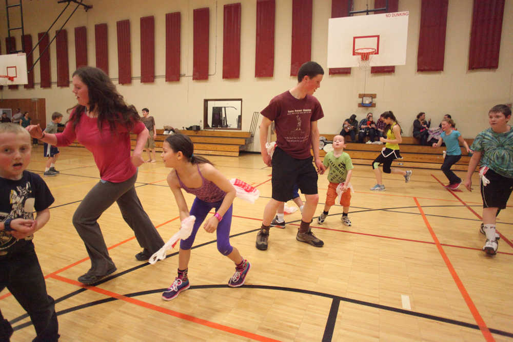 Photo by Kelly Sullivan/ Peninsula Clarion A group of students plays tag with recycled grocery bags Tuesday, March 29, 2016, at the Kenai Recreation Center in Kenai, Alaska.