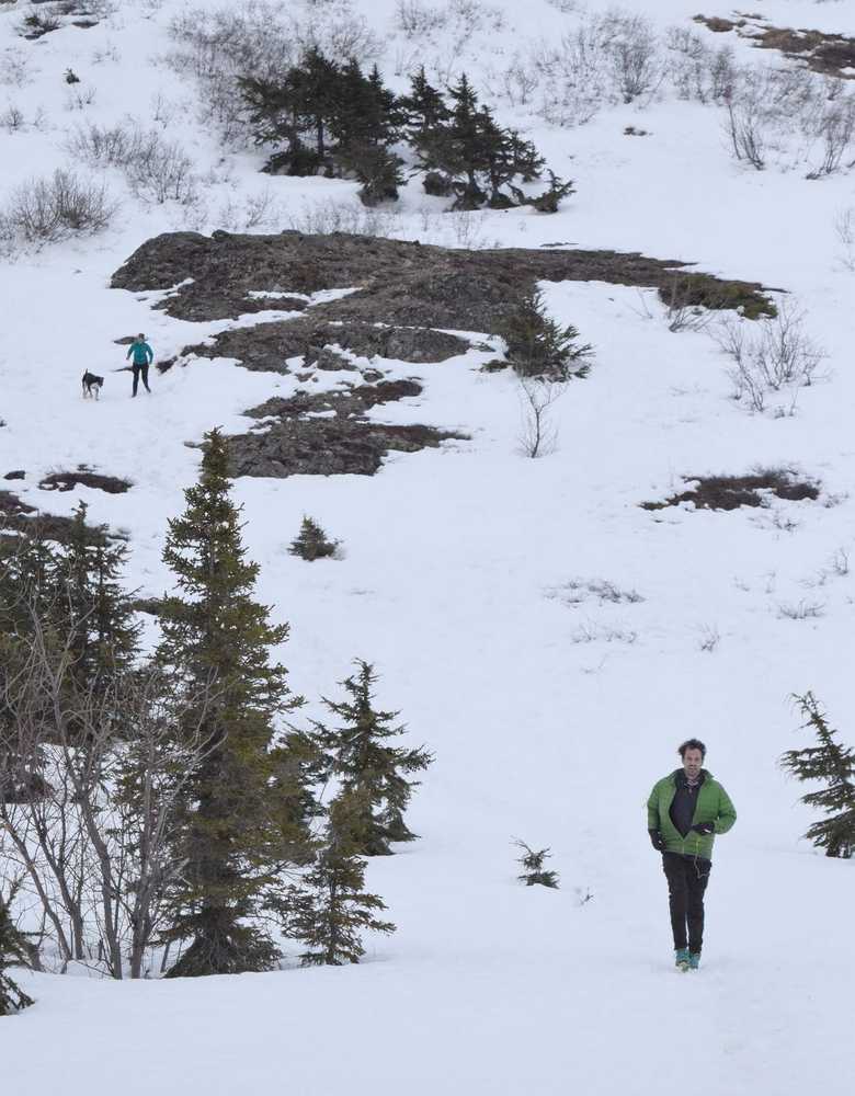 Photo by Joey Klecka/Peninsula Clarion Kara (upper left) and Zach Johnston (lower right) of Soldotna descend the upper slopes of snowy Skyline peak on April 8.