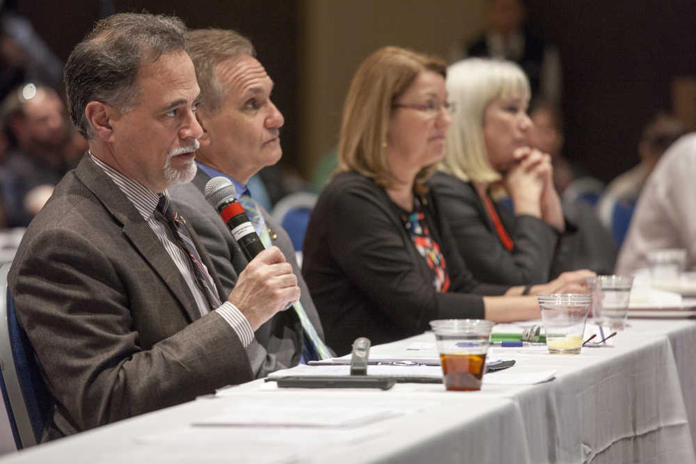 Sen. Peter Micciche, R-Soldotna, asks a question about the state administration's modeling of various budget scenarios during a town hall-style meeting between the state's Governor and legislators on Wednesday, April 20, 2016, in Juneau, Alaska. (AP Photo/Rashah McChesney)