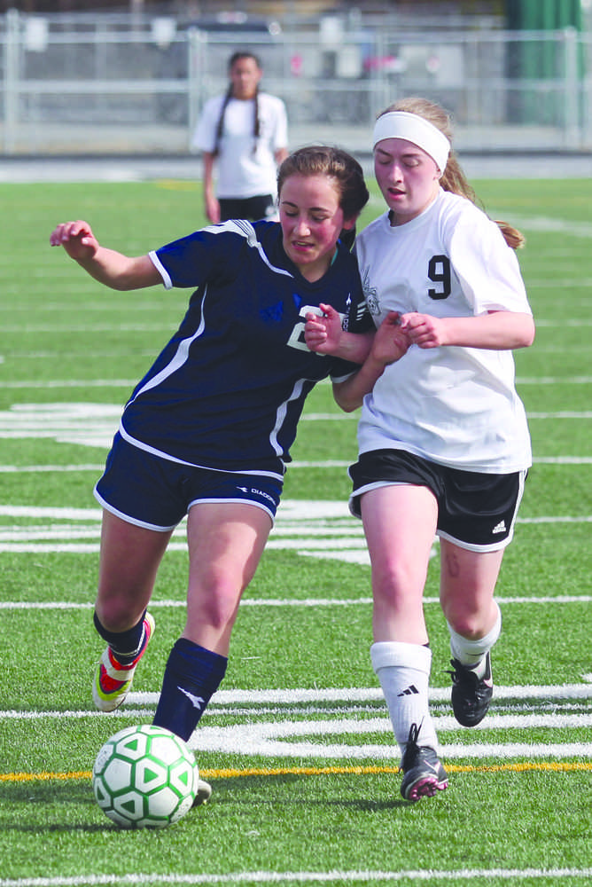 Soldotna's Elena Bramante and Colony's Autumn Richardson battle for possesion during Soldotna's 2-1 Northern Lights Conference win over Colony April 23 at Colony High School.