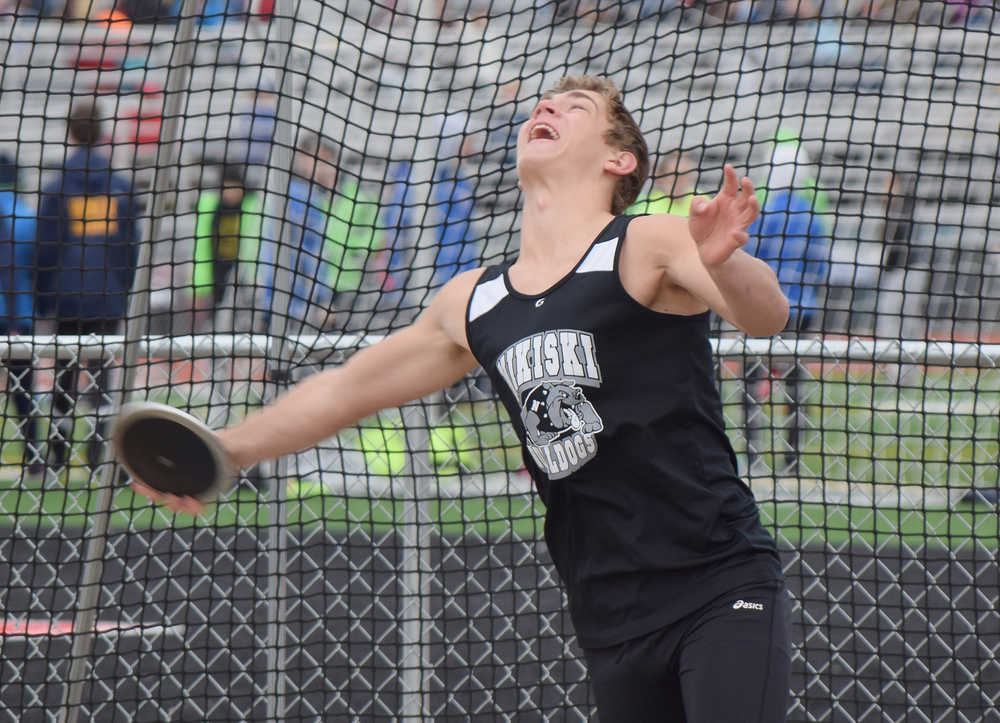Photo by Joey Klecka/Peninsula Clarion Nikiski sophomore Ian Johnson releases the disc in the boys discus throw finals Saturday afternoon at Kenai Central High School.