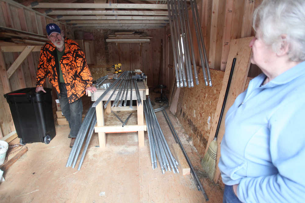 Photo by Kelly Sullivan/ Peninsula Clarion Steve Dahl and Louise Heite talk about plans for their property Tuesday, March 15, 2016, at Eagle Glade Farm LLC., in Nikiski, Alaska.