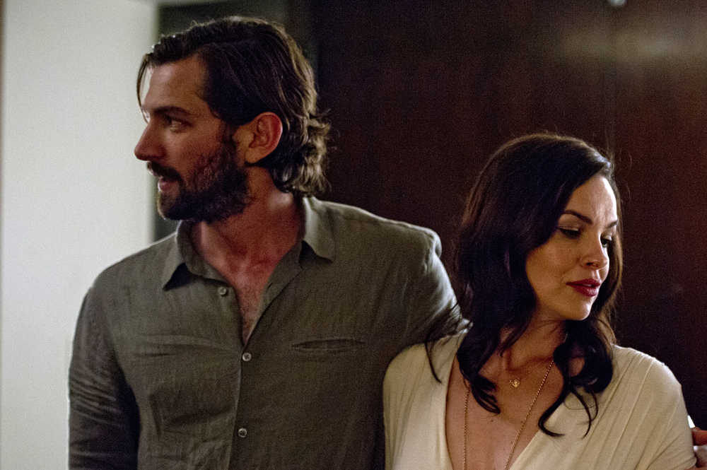In this image released by Drafthouse Films, Michiel Huisman, left, and Tammy Blanchard appear in a scene from the psychological thriller, "The Invitation." (Drafthouse Films via AP)