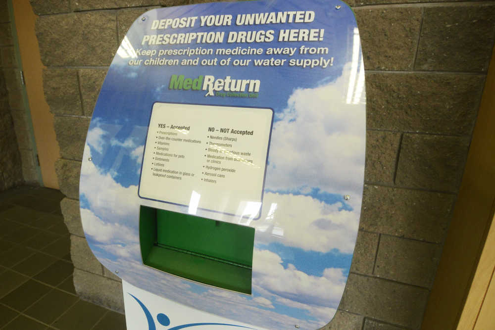 Photo by Megan Pacer/Peninsula Clarion A recently reinstalled drop box for prescription drugs sits in the lobby of the Soldotna Police Department on Thursday, April 28, 2016 in Soldotna, Alaska. Drugs collected through the box are sent to the U.S. Drug Enforcement Agency to be disposed of.