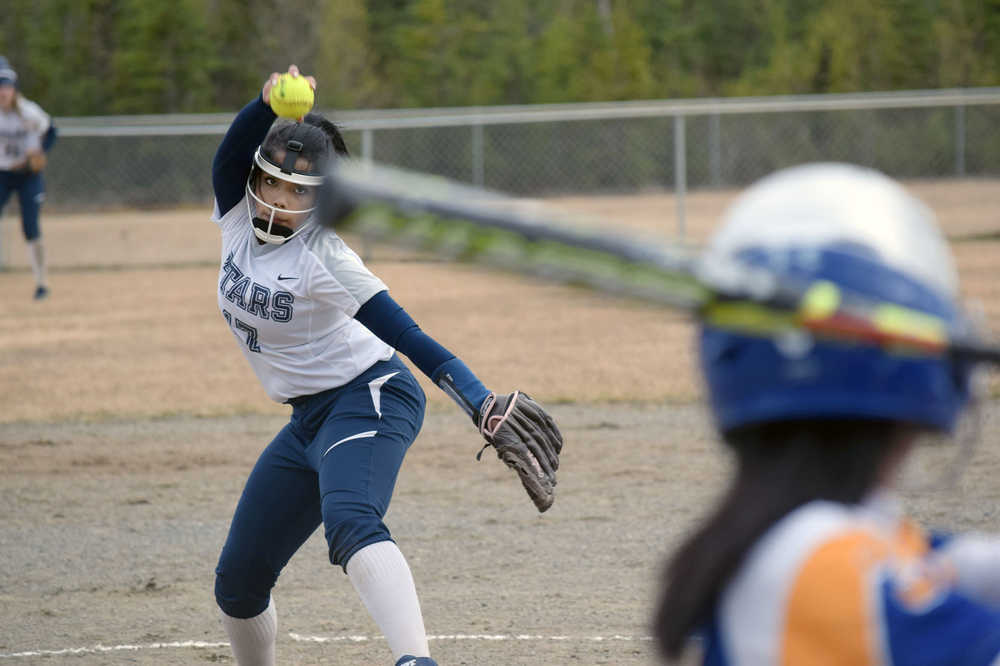 Photo by Jeff Helminiak/Peninsula Clarion Soldotna pitcher Emily Jackson fires toward home against Kodiak in the third inning Friday at Soldotna Little League fields. Jackson threw a no-hitter in the Stars' 14-1 victory.
