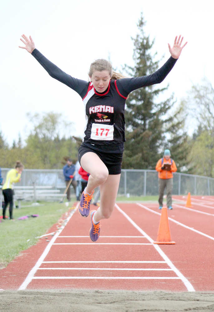 Kenai Kardinal Brooke Satathite performs the triple jump event during the finals at the Homer Invite on Saturday, April 30.