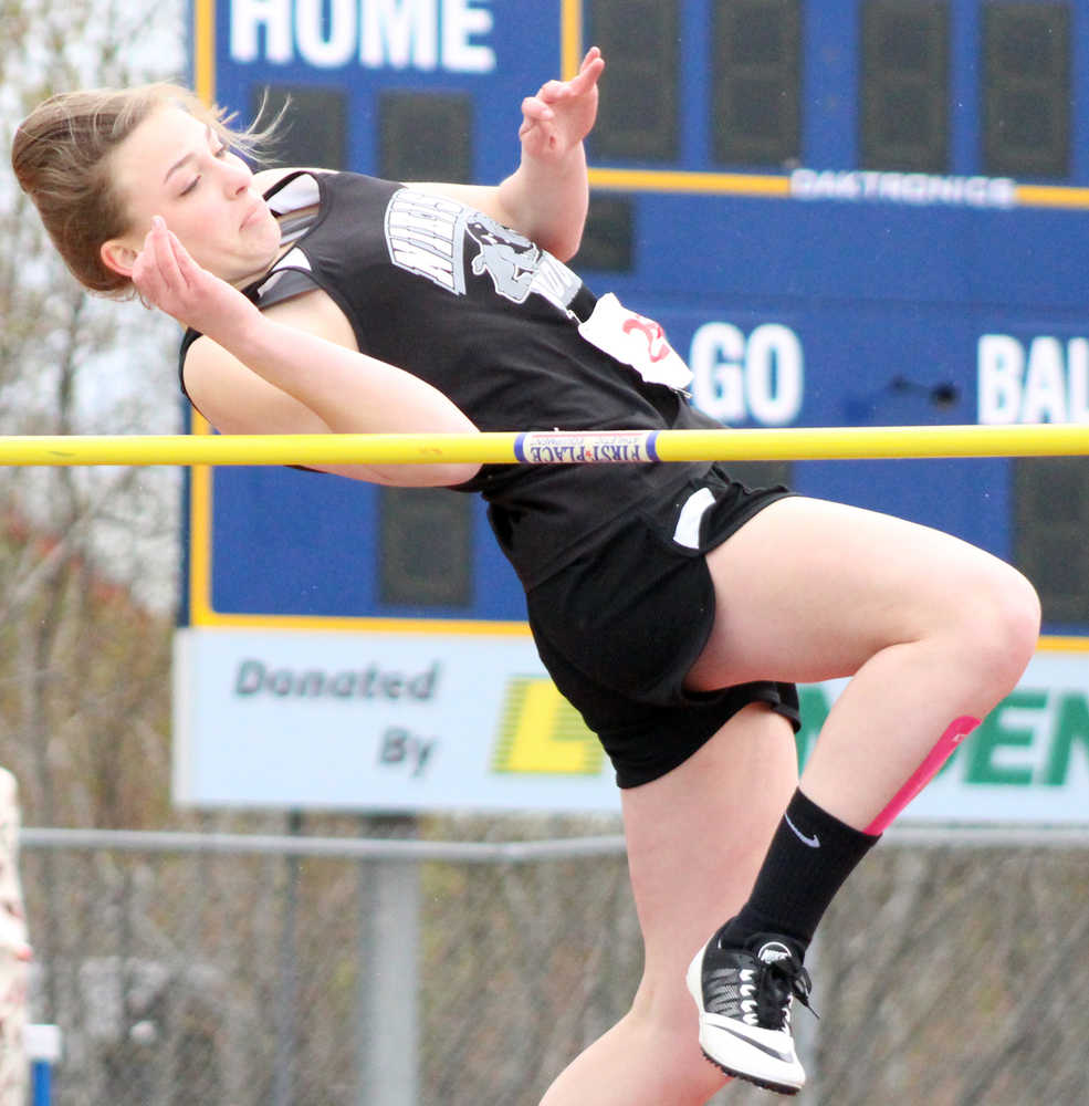 Nikiski Bulldog Bethany Carstens flies over the high jump bar duing the finals on Saturday, April 30 at the Homer Invite.