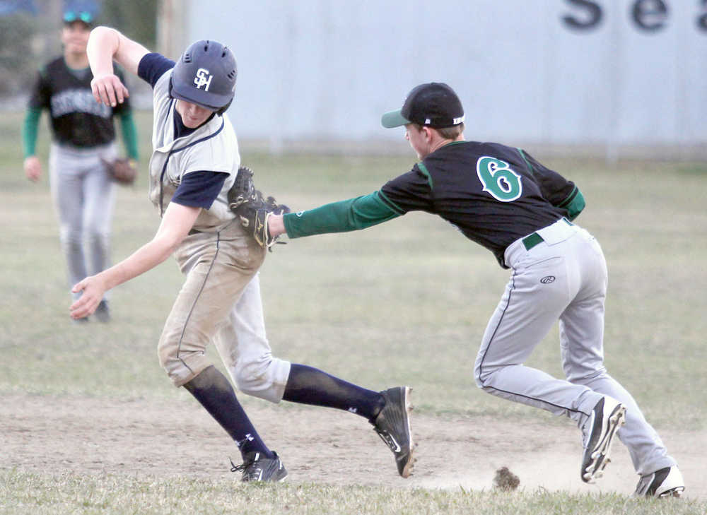 Colony infielder Trace Severson tags Soldotna's ??? Quelland after the SoHi baserunner rounded second base during a victory over the Knights May 6, 2016, at the Palmer Senior Field in Palmer.