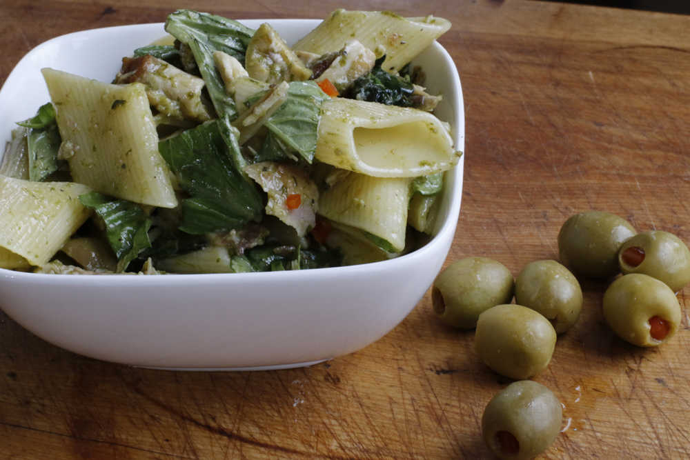 This April 11, 2016 photo shows pasta salad with chicken, green olives and ramp vinaigrette in Concord, N.H. Ramps, wild leeks that are unable to be cultivated, are one of the first vegetables to appear in farmers markets and on chefs' menus after a winter of tubers and citrus. (AP Photo/J.M. Hirsch)