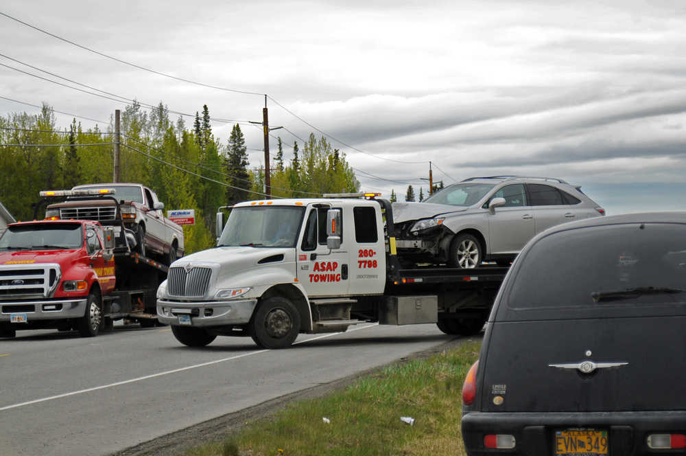 Photo by Elizabeth Earl/Peninsula Clarion Three vehicles were towed from the scene of an accident on the Kenai Spur Highway in Kenai, Alaska on Wednesday, May 11, 2016. Of the four people involved, two were taken to Central Peninsula Hospital in Soldotna with non-life threatening injuries.