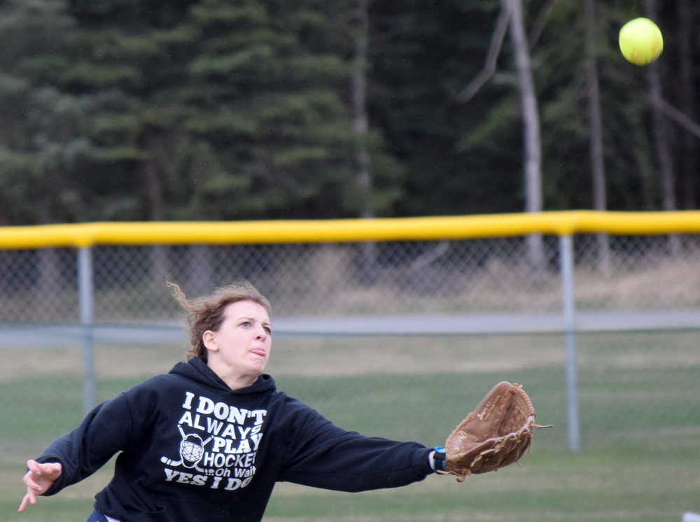 Photo by Jeff Helminiak/Peninsula Clarion Soldotna right fielder Alicia McClelland can't catch up to a triple by Kenai Central's Darcy Blume in the bottom of the second inning Wednesday, May 11, 2016, at Steve Shearer Memorial Ball Park in Kenai.
