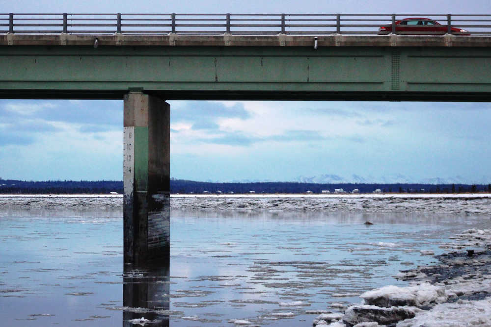 Ice floats in the Kenai River beneath Warren Ames Bridge on Jan. 18, 2016 in Kenai. This winter Kenai Peninsula rivers had fewer freezing days and less ice, which may lead to a longer fishing season and unpredictable effects on salmon populations.