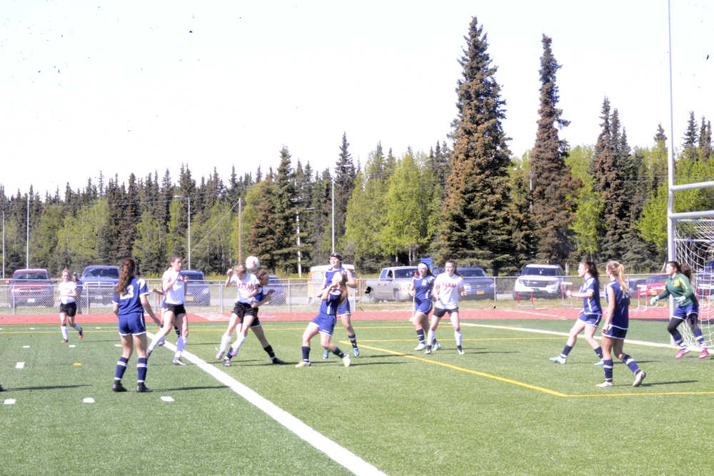 Kenai Central freshman forward Hayley Maw attempts to head a crossing pass toward the goal against SoHi at Ed Hollier Field in Kenai Saturday. The two teams played to a 0-0 draw in the season finale.